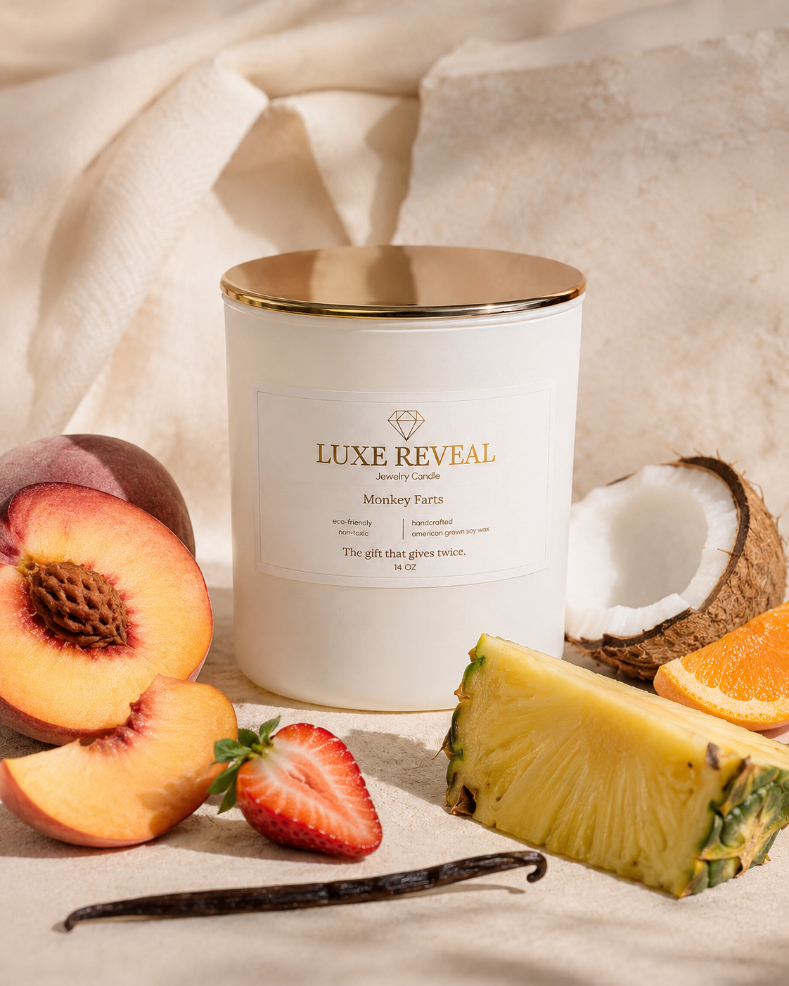 Monkey Farts Luxe Reveal candle styled with peach, strawberry, pineapple, coconut and orange
