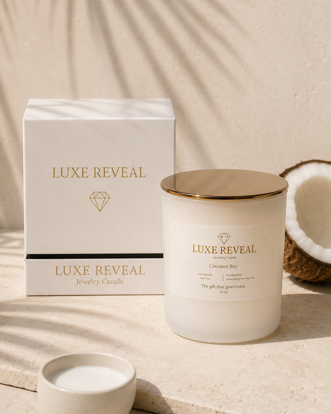 Coconut Bay Luxe Reveal candle beside the white Luxe Reveal gift box with fresh coconut