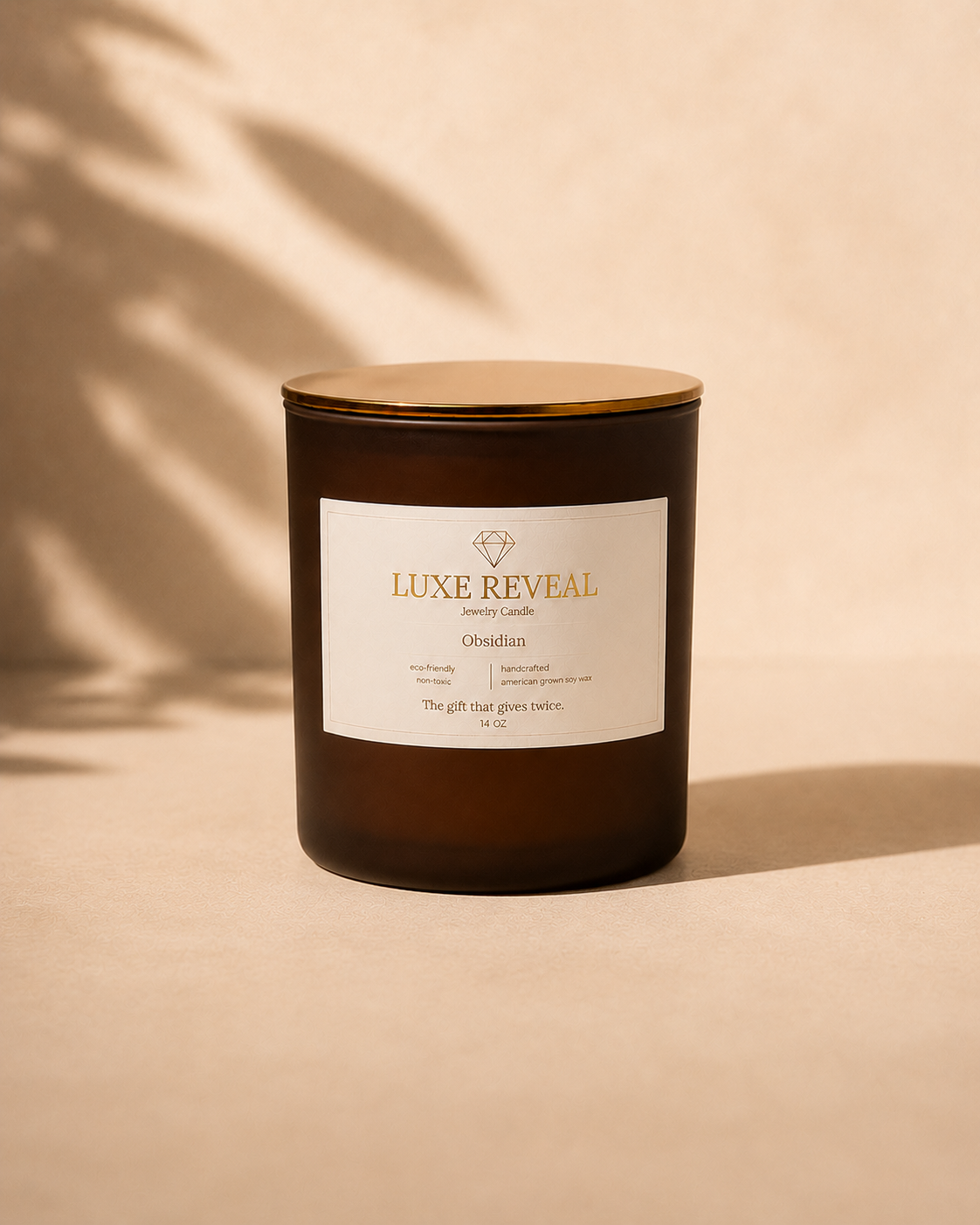 Obsidian Luxe Reveal jewelry candle with its label in clear view