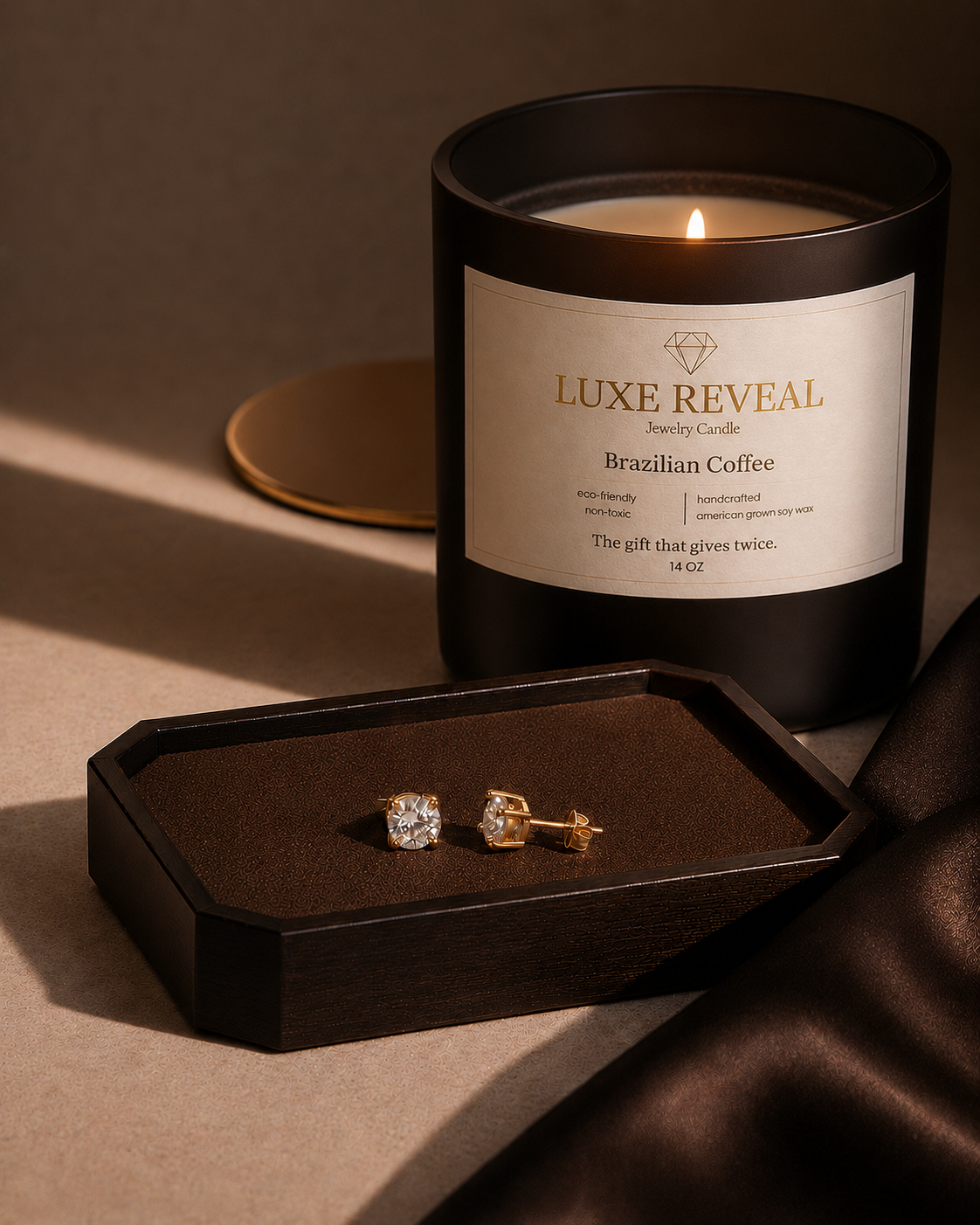 Lit Brazilian Coffee Luxe Reveal candle with a jewelry tray and revealed diamond stud earrings