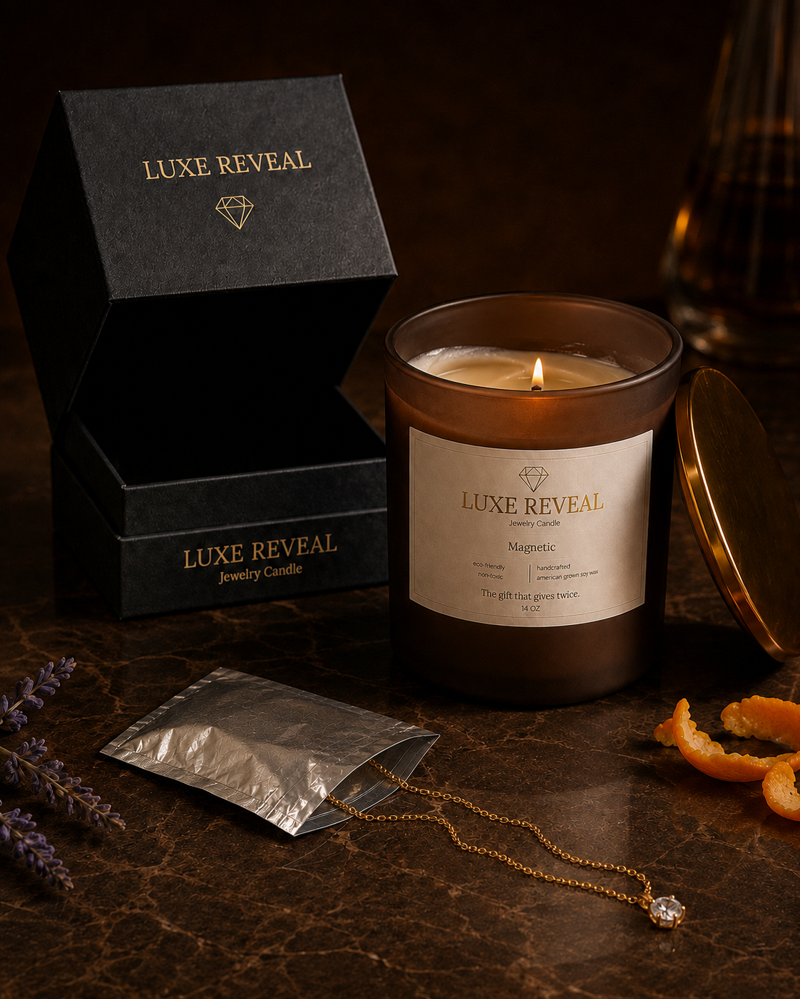Open silver pouch beside the lit brown Magnetic Luxe Reveal candle revealing the gold necklace with a solitaire diamond